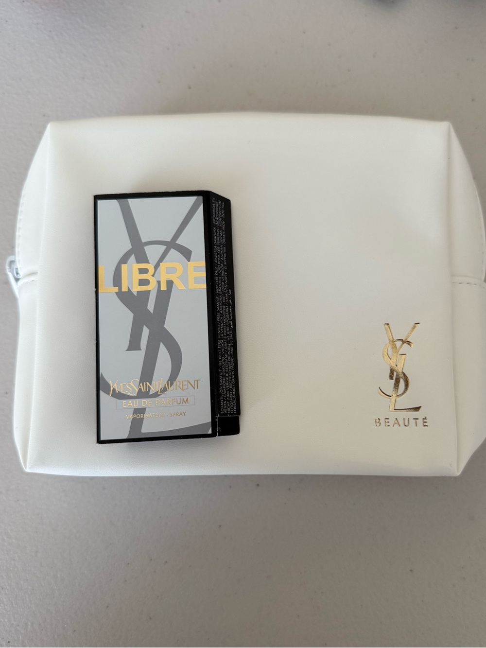 Yves Saint Laurent White Toiletry Pouch with sample Libre perfume